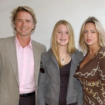 Karis Schneider with her mom and dad.
